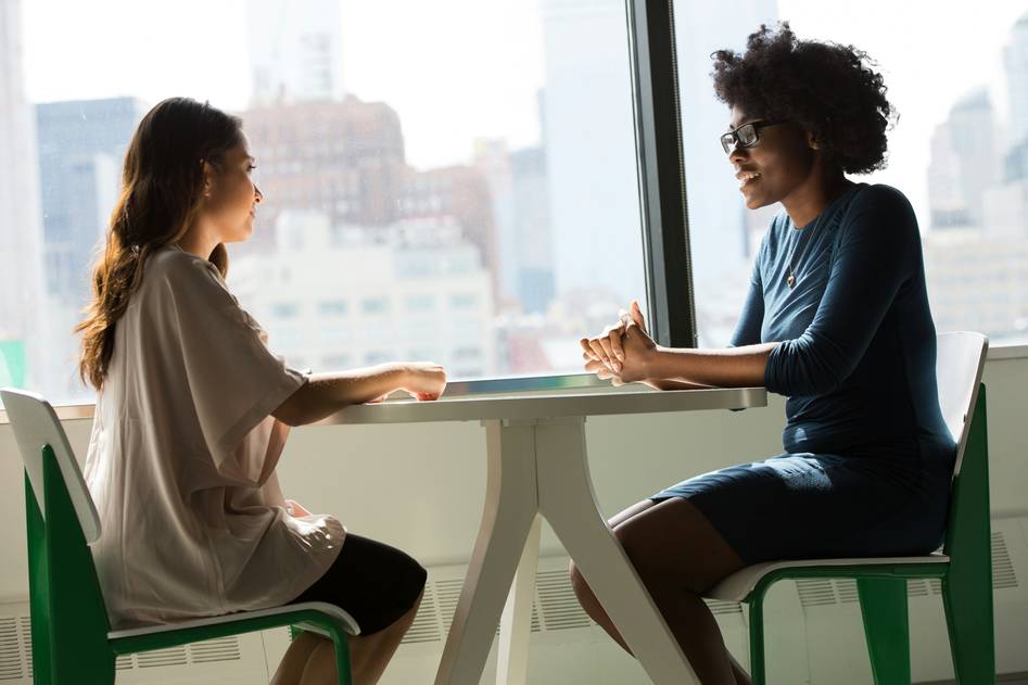 Team of career coaches collaborating on interview strategy blog content